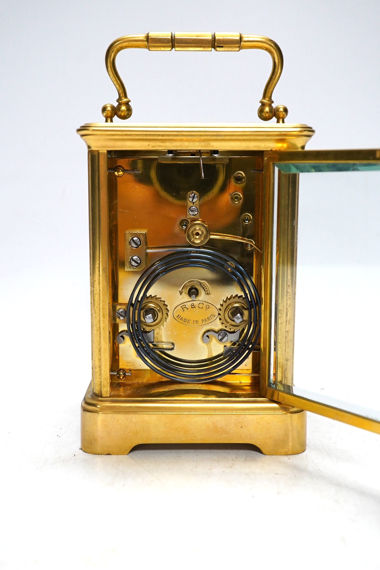 An early 20th century French brass carriage clock by R & Co., Paris. 14.5cm tall. No key. Condition - fair. Not tested as working